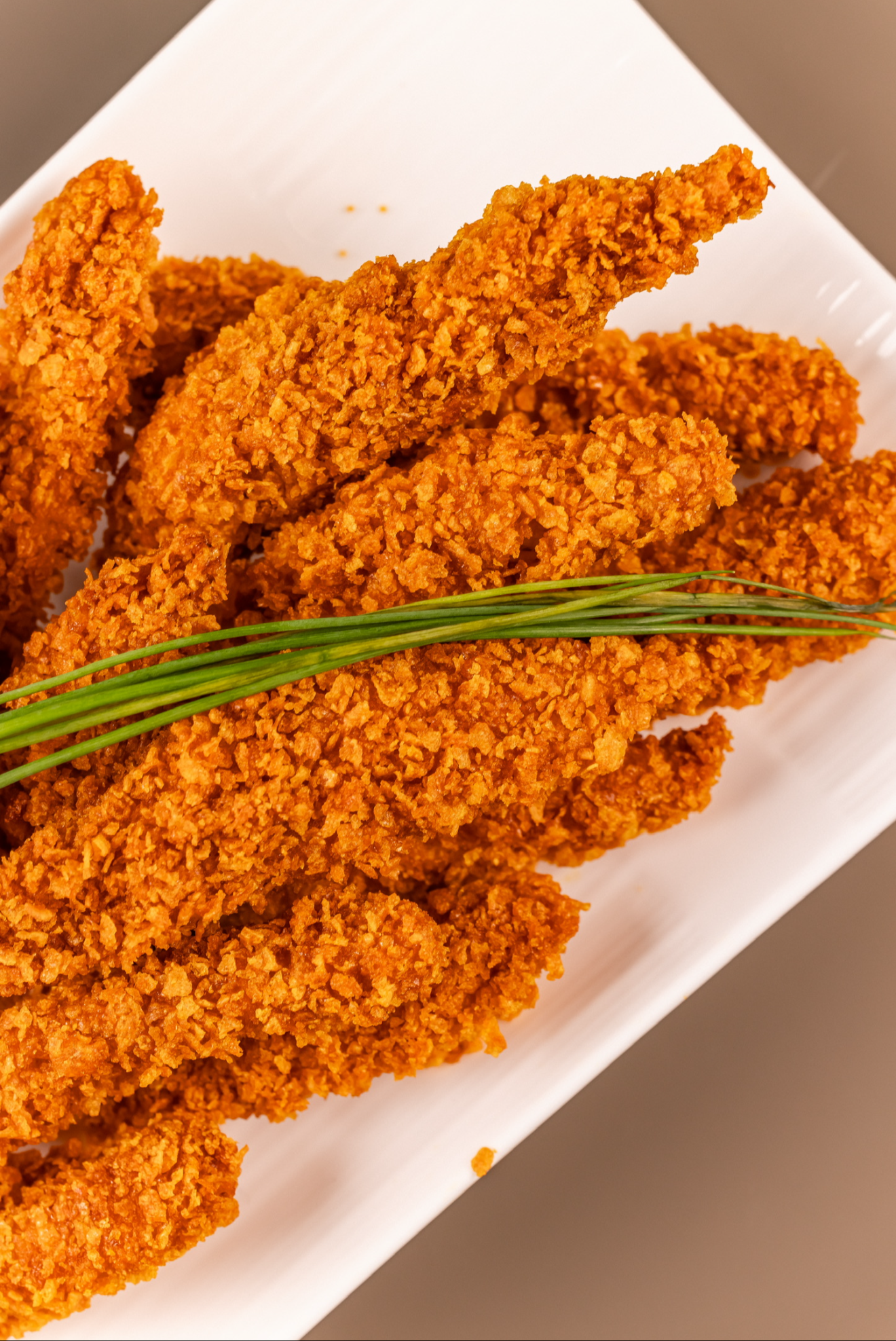 Strips de Pollo con Cornflakes - 24 unidades
